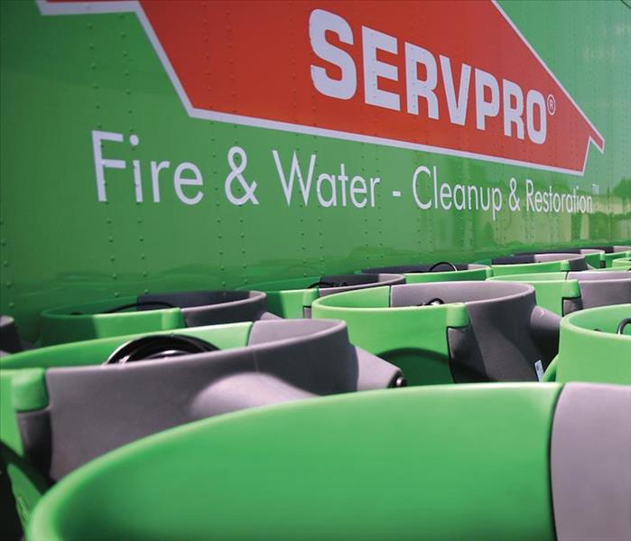 servpro fire and water cleanup on side of van