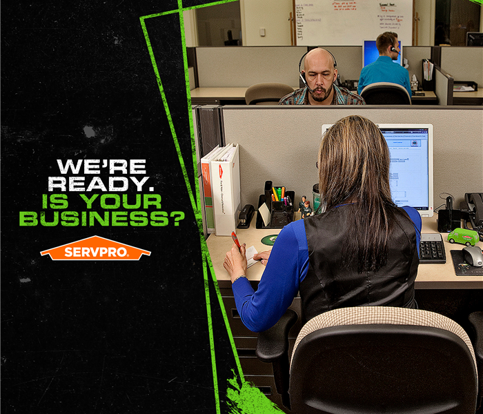 SERVPRO office crew sitting at their desk in front of computer monitors answering calls